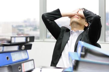 Thoughtful or stressful businessman at work © tigger11th