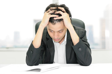 Thoughtful or stressful businessman at work © tigger11th