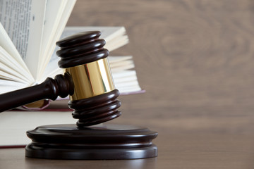 wooden gavel and books
