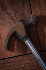 Top view of hammer on wood table,