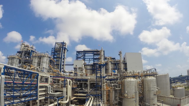 Time lapse of Chemical Industrial plant with blue sky