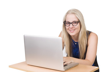 young blond woman with glasses typing