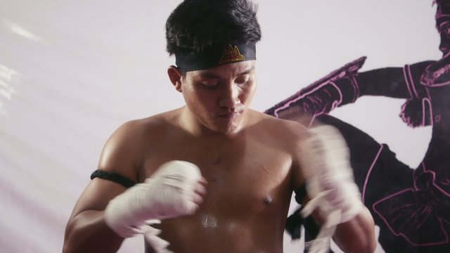9of20 Asian man training kickboxing in gym as fighter