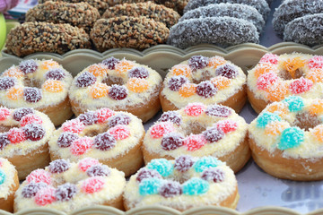 A lot of donuts and strawberry jam