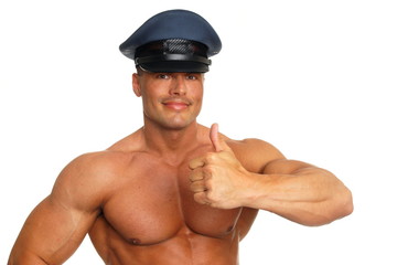 Big muscular man at police showing thumb up