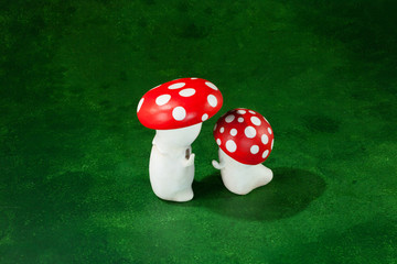 two cute puppets handmade, green background