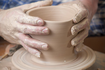 Fototapeta na wymiar Hands of a potter