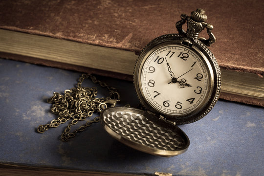 Pocket watch with antique book