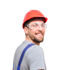 Bauarbeiter mit Schutzbrille und Bauhelm isoliert
