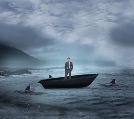 Composite image of thinking businessman in a sailboat