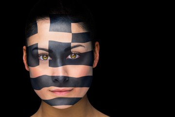 Composite image of greek football fan in face paint