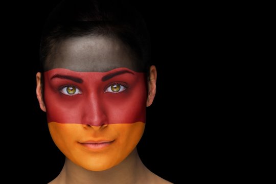 Composite image of german football fan in face paint