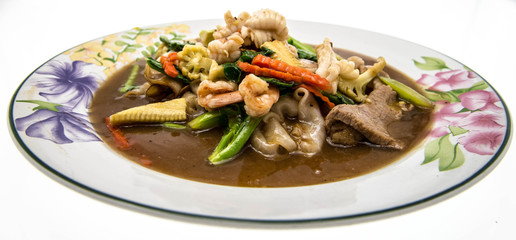 Fried noodle with pork, squid and shrimp soaked in gravy, Chines