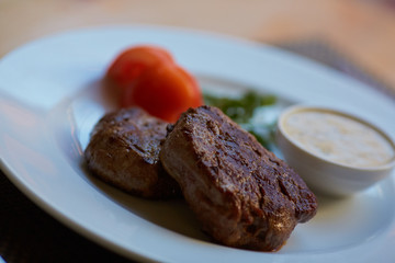 steak with sauce and vegetables