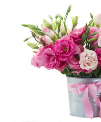 bunch eustoma flowers in metal pot