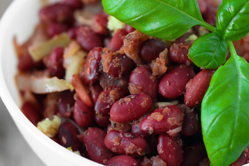 Cooked spicy red beans with tomato sauce and vegetables