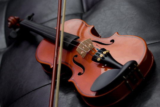 Classic old violin vintage on the leather background