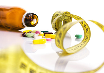 centimeter and pills for dieting concept
