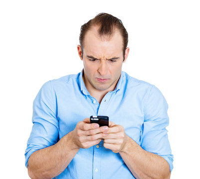 Bad text message. Upset business man holding smart phone