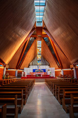 Interior of large modern catholic cathedral with high ceiling