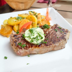 steak beef meat with tomato and french fries