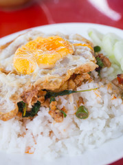 fried basil chicken with fried egg and rice