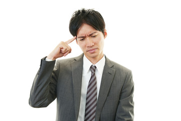頭痛を訴えるビジネスマン