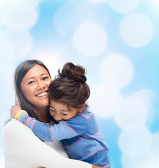 hugging mother and daughter