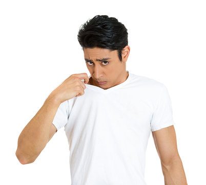 Young man in Sticky, unpleasant  situation, white background 