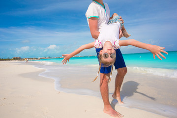 Happy father and his little cute girl enjoy summer vacation at