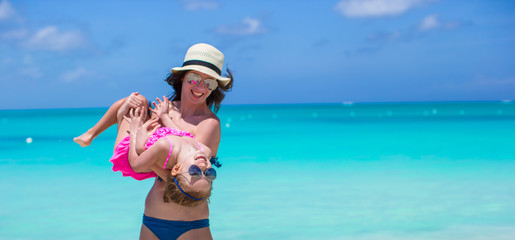 Mother with her cute daughter have fun on summer vacation