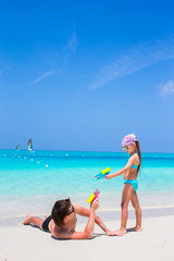 Happy father with his little kid enjoying beach vacation