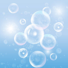 Group of transparent spheres on blue background