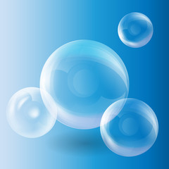 Group of transparent spheres on a blue background