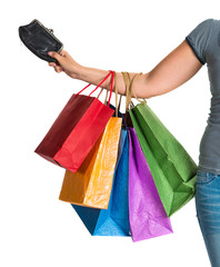 Female hand holding shopping bags and purse