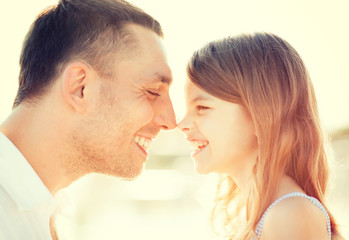 happy father and child girl having fun