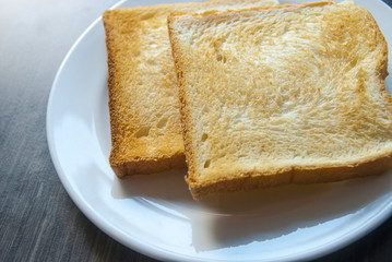 Slices of toast on wood table