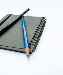 Blank note book with pencils
