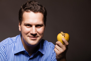 Diet nutrition. Happy man holding apple fruit