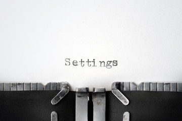 "Settings" written on an old typewriter