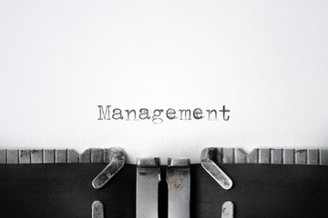 "Management" written on an old typewriter