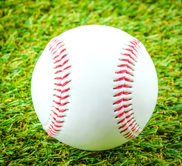 Baseball on green grass