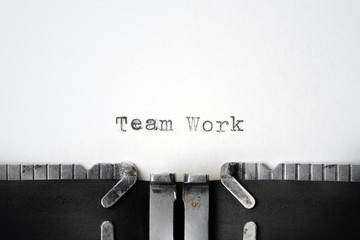 "Team Work" written on an old typewriter