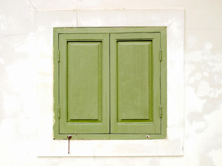 window in a wall with wooden