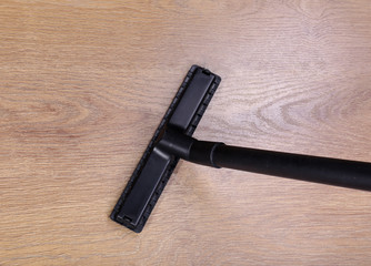 Vacuuming floor in house
