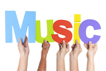 Group of Multiethnic Hands Holding Word Music