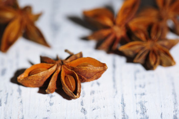 Star anise on wooden background