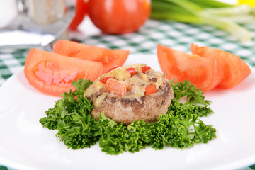 Stuffed mushrooms on plate on table close-up