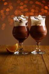 Tasty dessert with chocolate, cream and orange sauce,