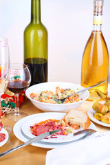 Table with festive dishes after feast close-up